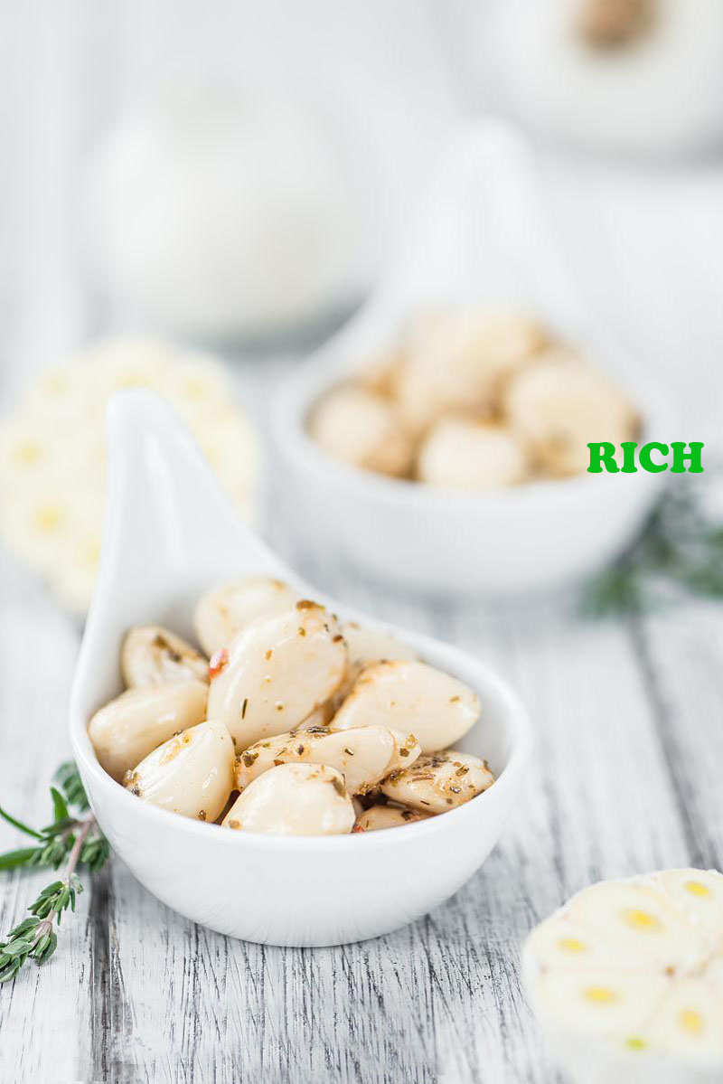 Pickled fresh peeled garlic cloves in brine