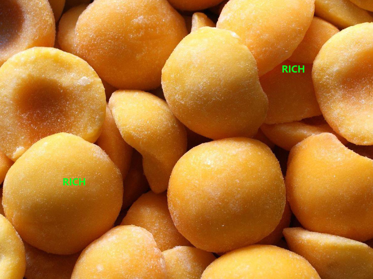 Half cut frozen yellow peaches